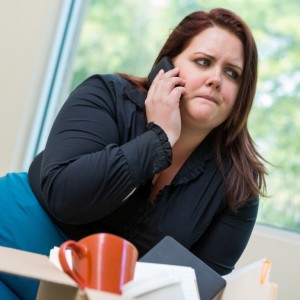"I'm sorry, phone. The apple fritters just smelled SO good." (Photo courtesy of istockphoto).